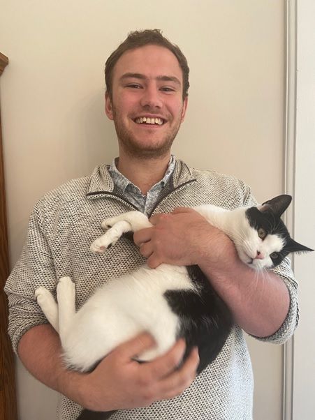 peter holding his cat